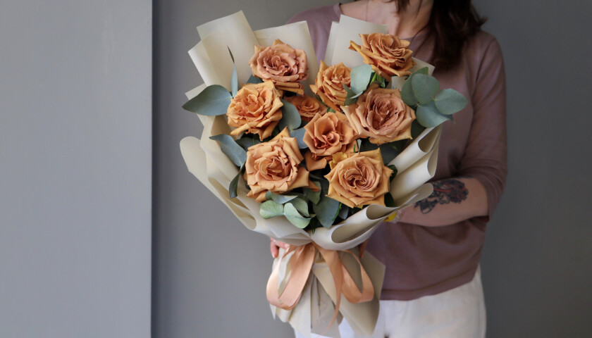Nine apricot garden roses in waterproof paper