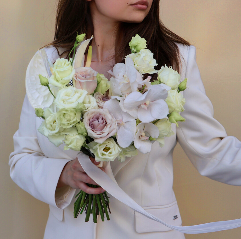 Elegant bouquet of white lisianthus and phalaenopsis orchids
