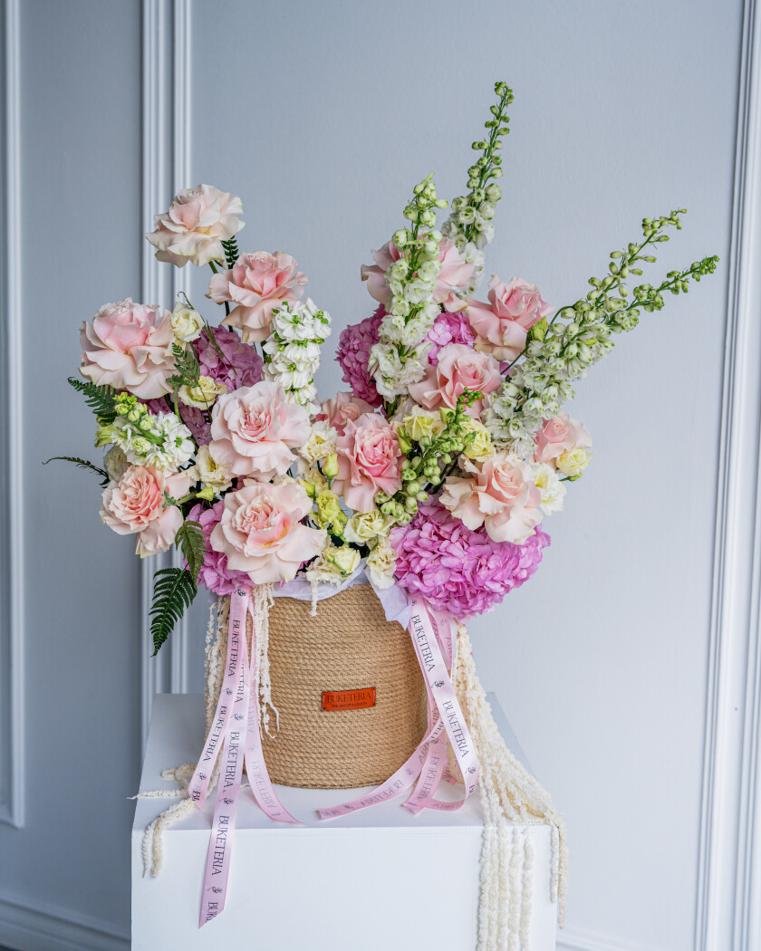 Thirteen peach garden roses with pink hydrangeas and light blue delphiniums