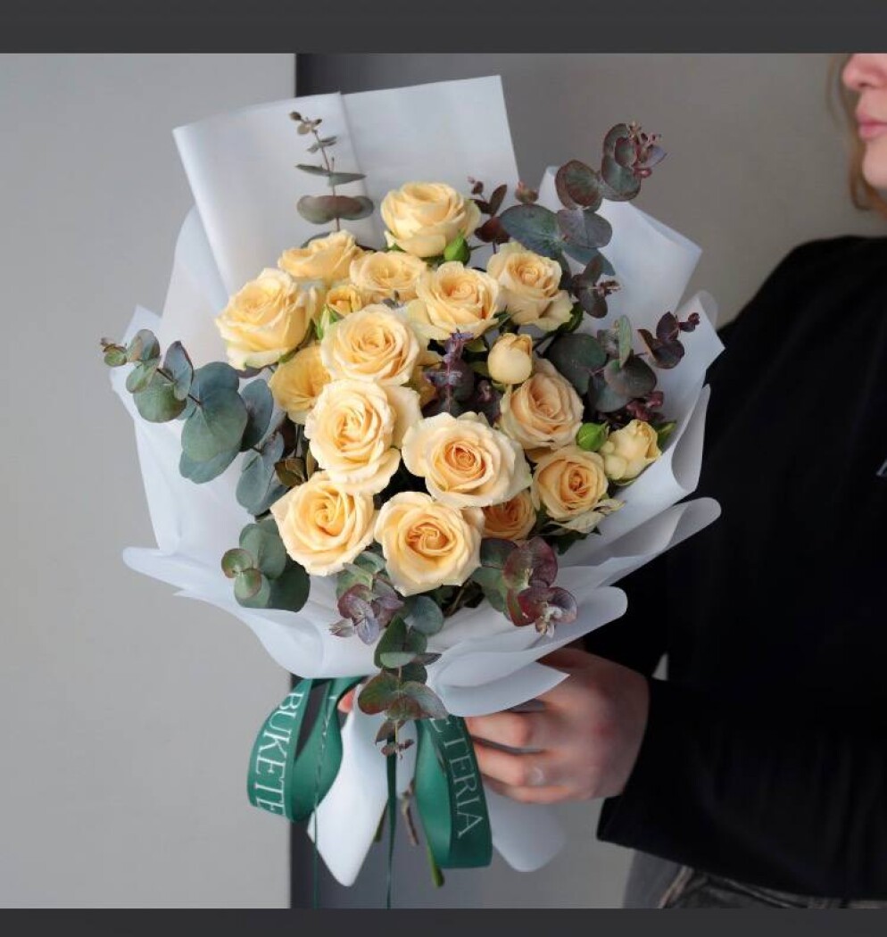 Three yellow spray roses in waterproof paper