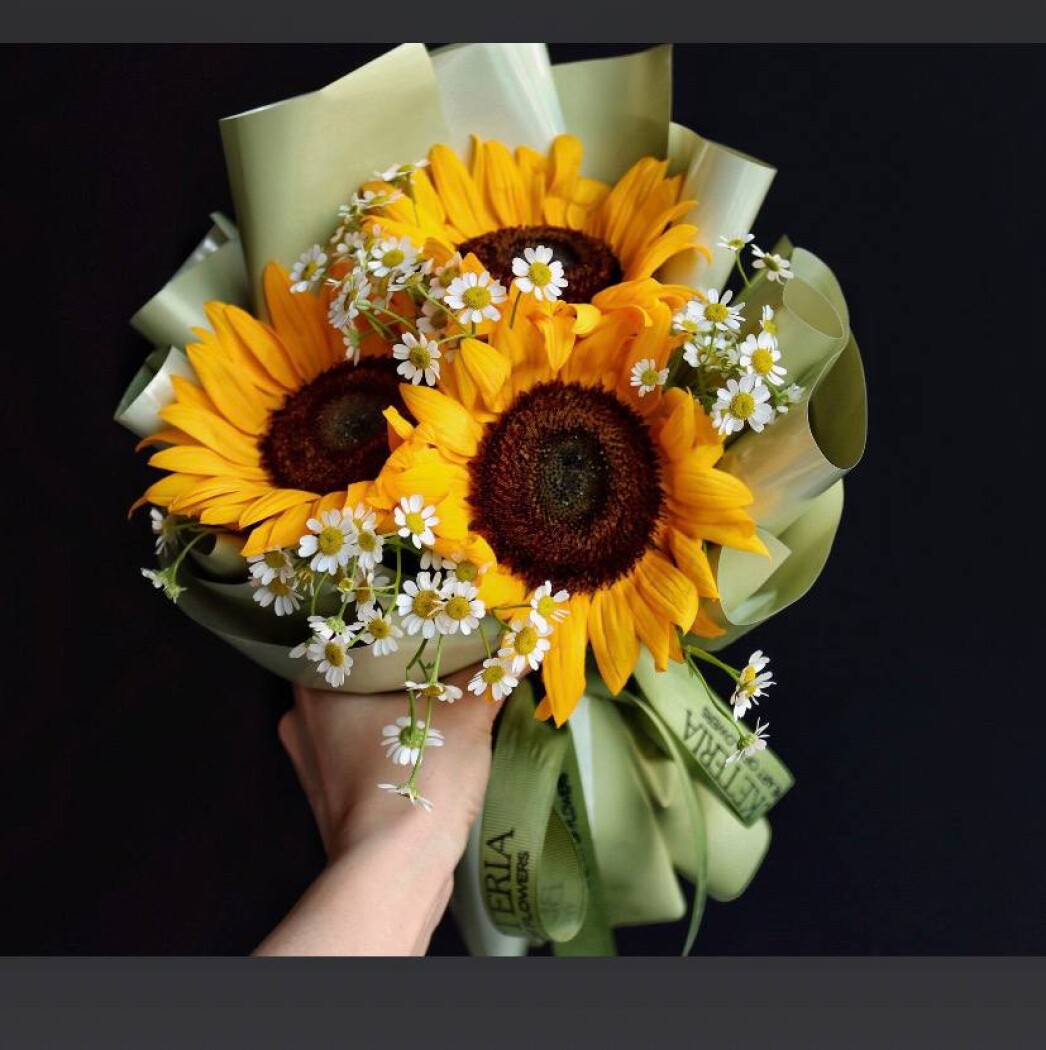 Three yellow sunflowers in waterproof paper