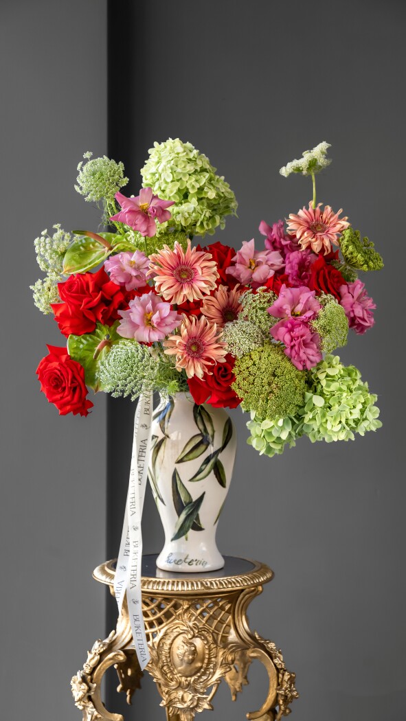 Red roses with green hydrangeas and peach gerberas