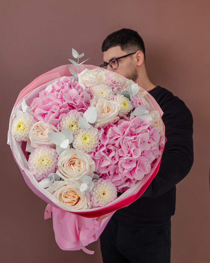 Pink ball dahlias with white garden roses and hydrangeas