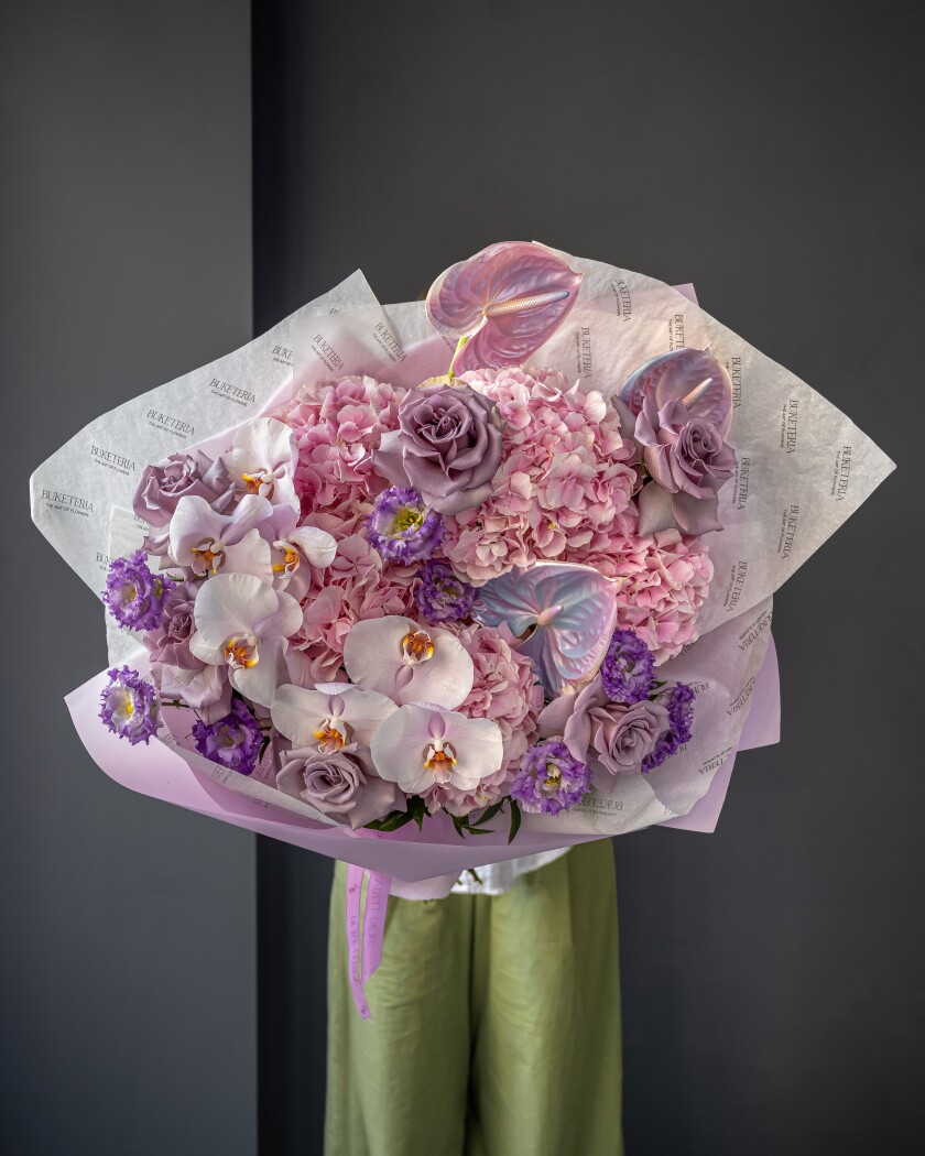Five pink hydrangeas with nine phalaenopsis orchids and three anthuriums