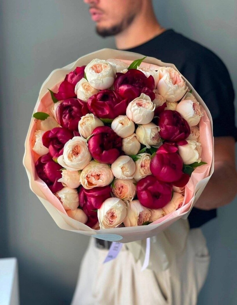 Burgundy peonies with cream spray roses