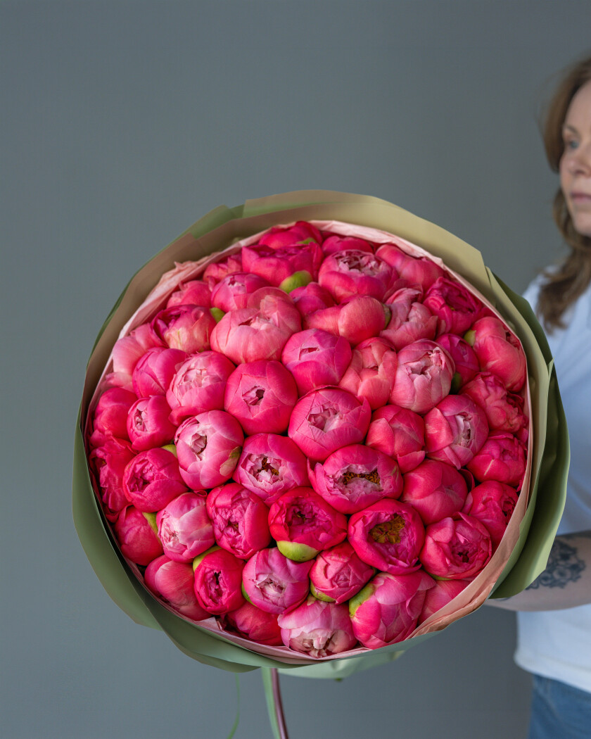 Fifty-one hot pink peonies in waterproof paper