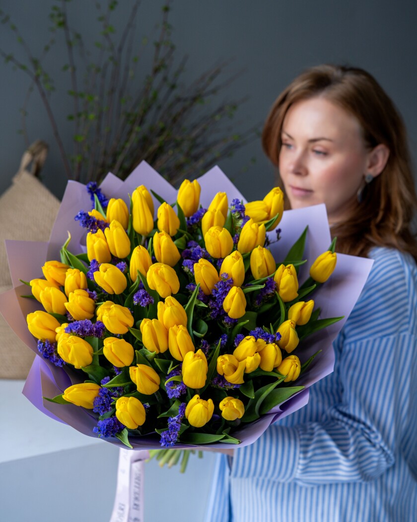 Fifty-one yellow tulips in waterproof paper