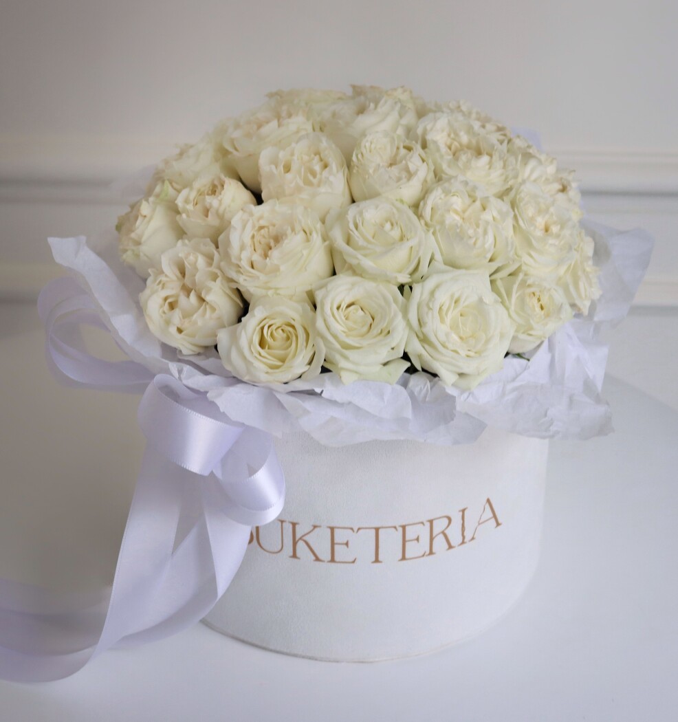Elegant composition of white spray roses in a box