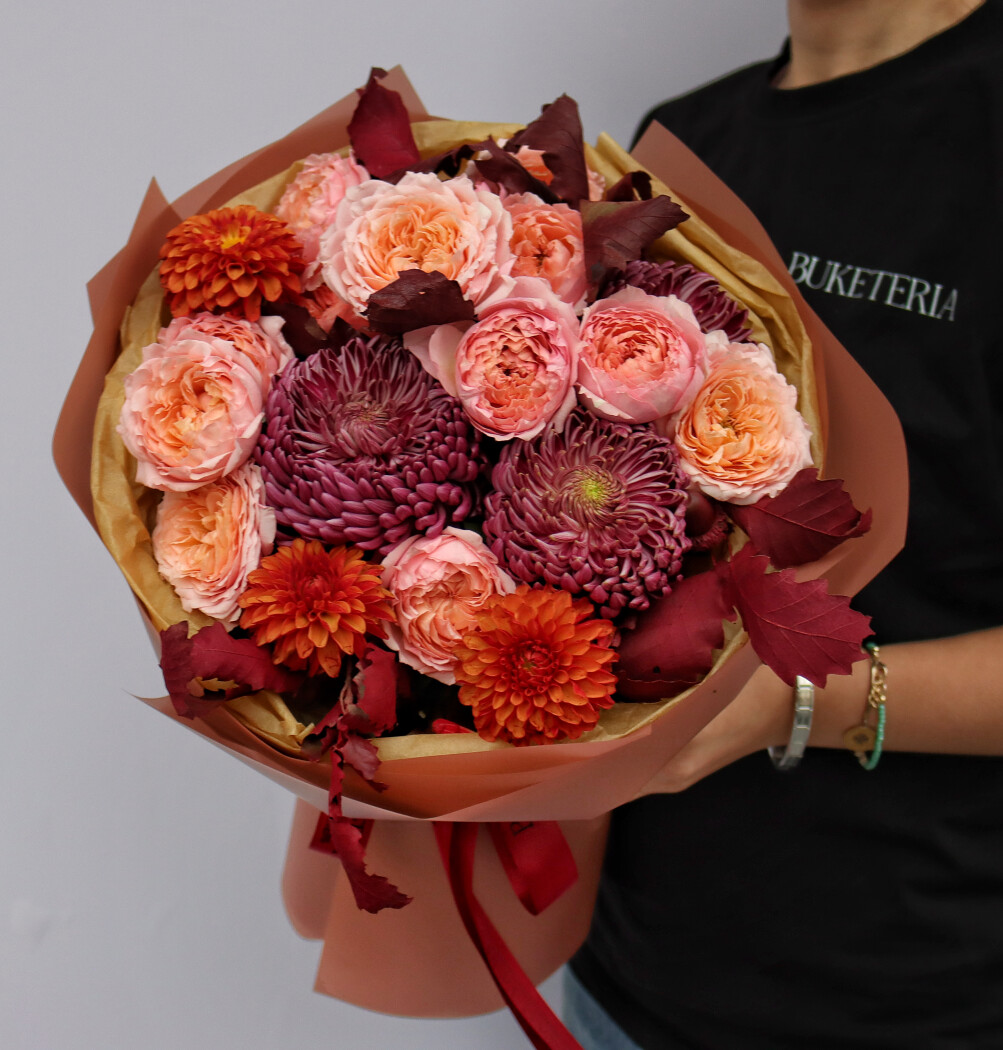 Peach spray roses with orange chrysanthemums and burgundy dahlias