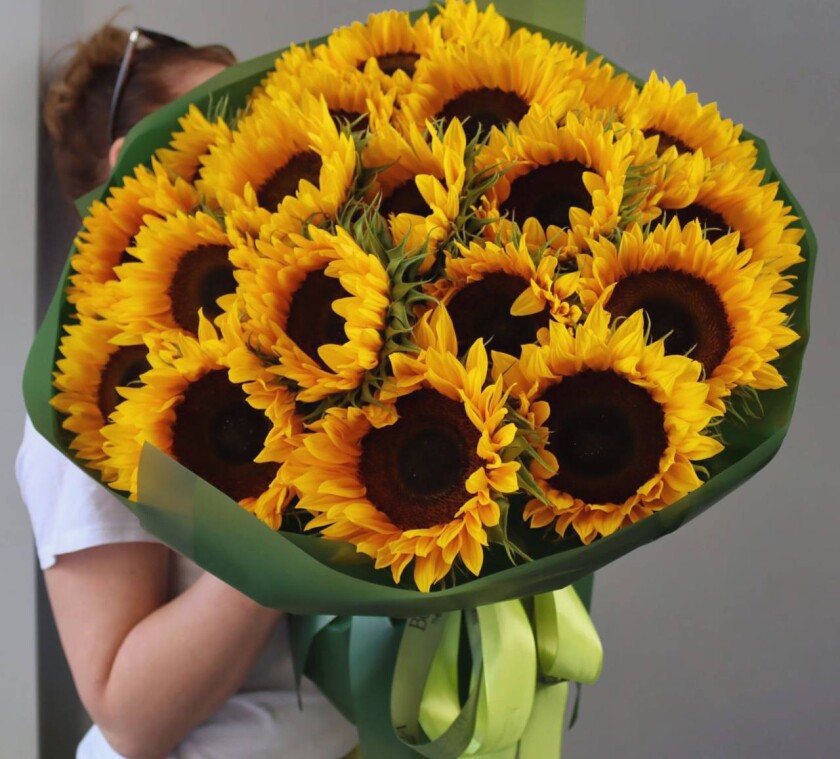 Twenty-one yellow sunflowers in waterproof paper