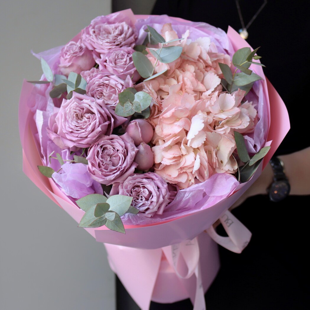 Three dusty pink spray roses with peach hydrangea