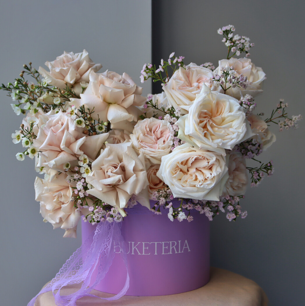 Blush garden roses in a decorative composition