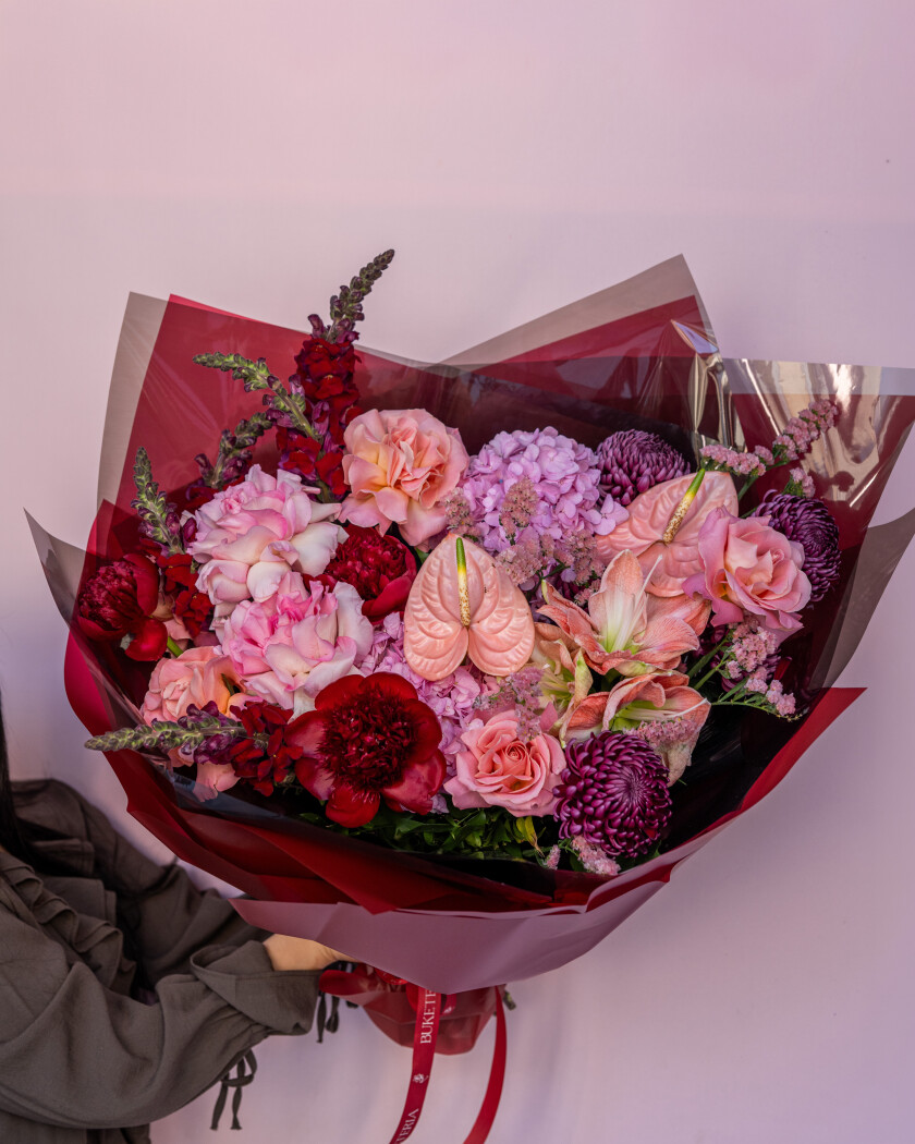 Six pink garden roses with hydrangeas and coral peonies