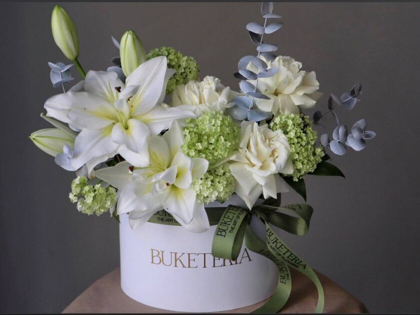 Three green viburnum with white garden roses and oriental lily
