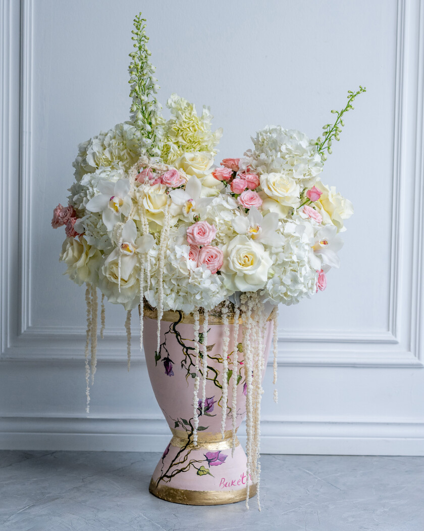 Seven white hydrangeas with blush and peach roses