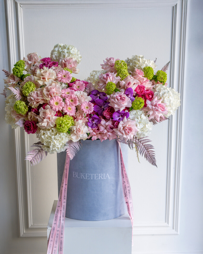 Thirteen deep pink garden roses with white hydrangeas