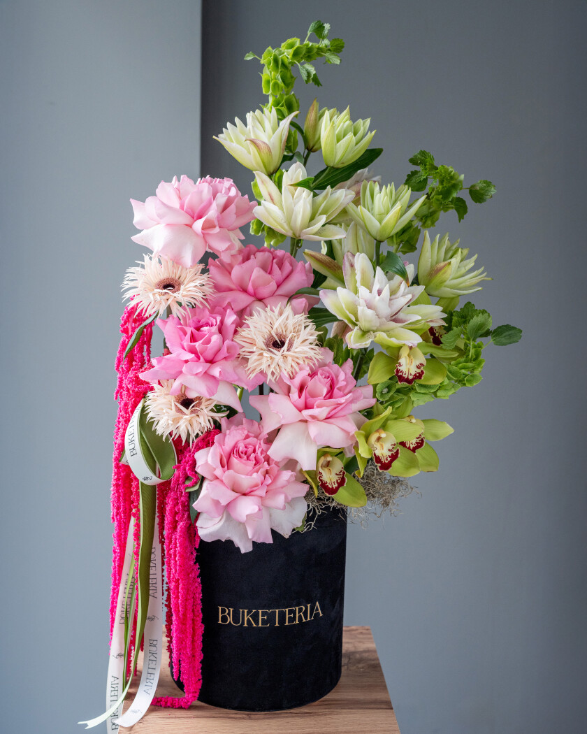 Blush garden roses with cymbidium orchids and amaranth
